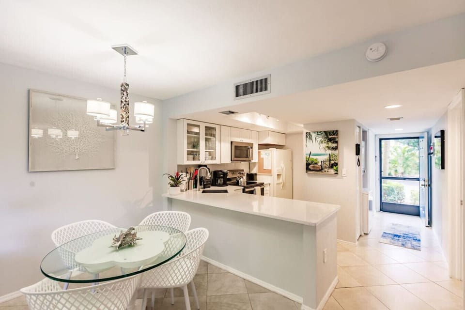 Dining area looking onto the kitchen and entrance area.