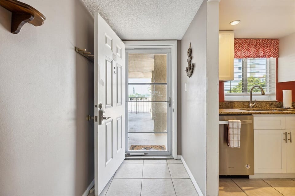 Front entryway with a welcoming atmosphere and tiled flooring