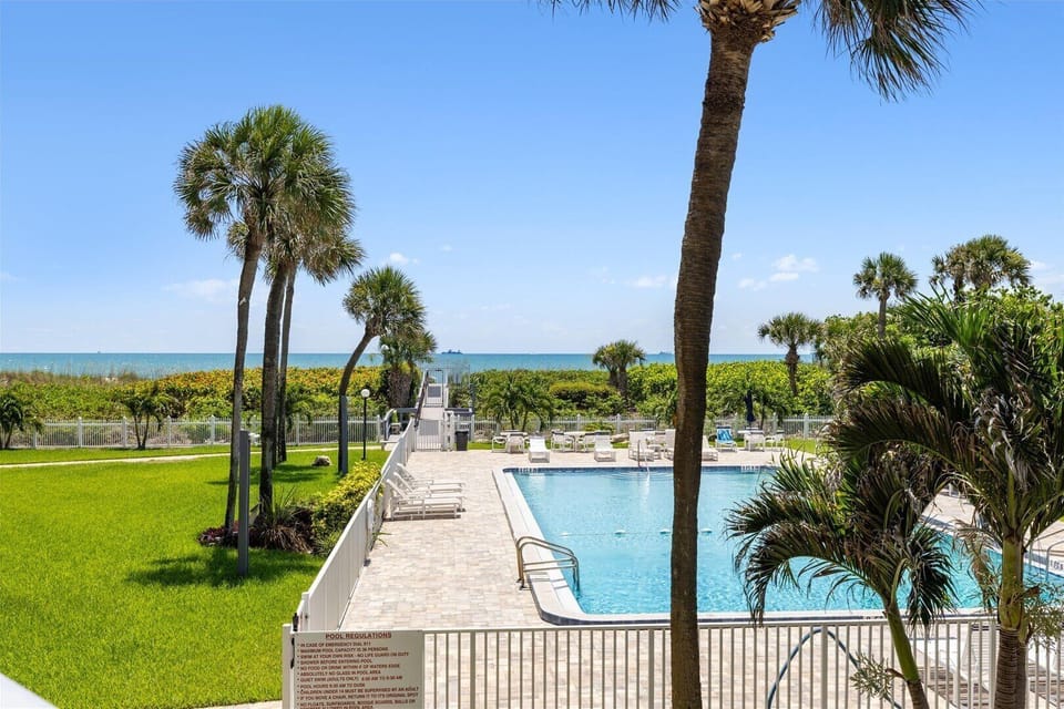 Private balcony with stunning ocean and poolside views