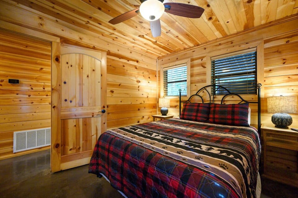 our cabin bedroom blends rustic elegance with modern comfort