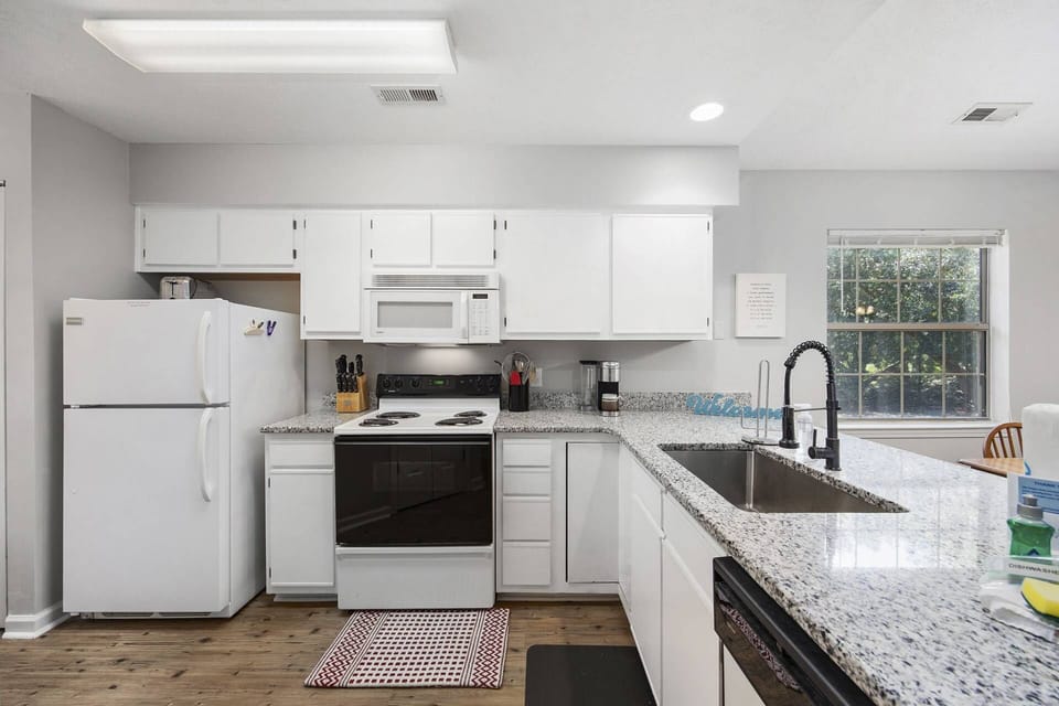 Kitchen with Breakfast Bar overlooking Living Area