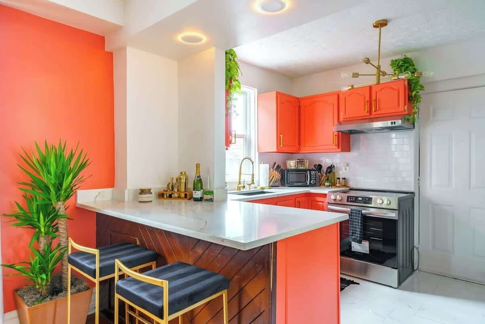 Elegant Dining Experience: Gather around the large dining table with wine glasses for a delightful meal. The kitchen includes a mini fridge, rice maker, and toaster to meet all your needs