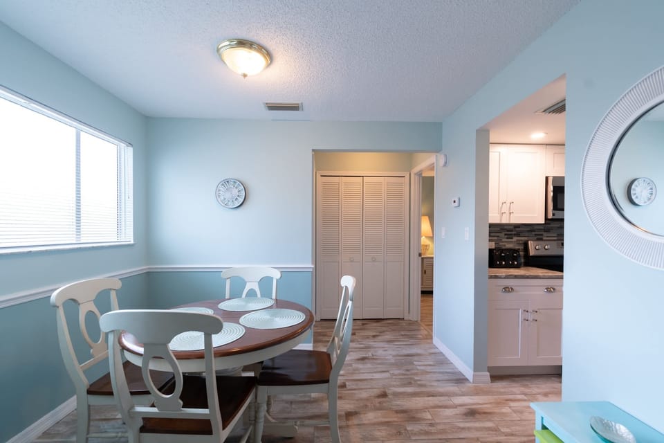 Dining area with natural light and access to the kitchen in a cozy home setting