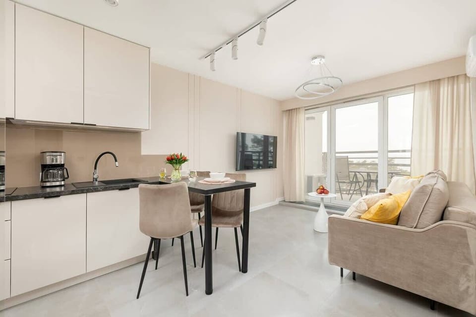 Harmonious design blends living, dining, and cooking spaces.


