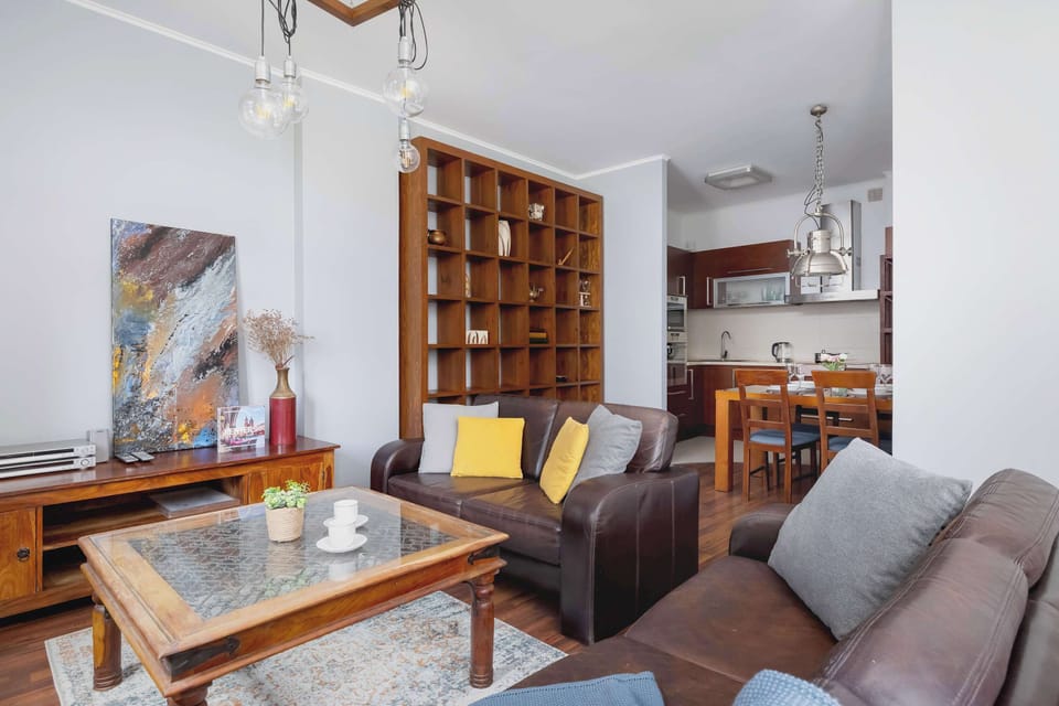 Elegant lounge space with decorative wood paneling, cozy lighting, and comfortable seating for relaxing evenings.