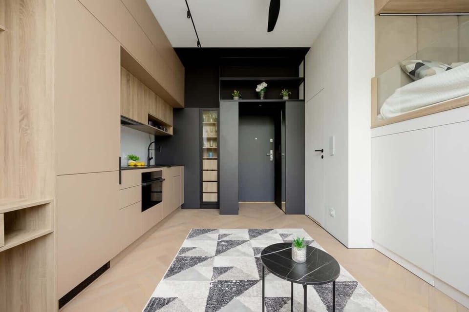 Harmoniously combining the living area with the kitchen area. Bright colours and modern furnishings give the room a spacious feel.