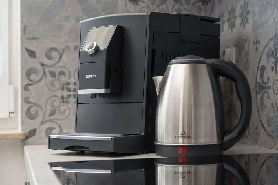 Coffee and tea station – Espresso machine and kettle for your convenience.

