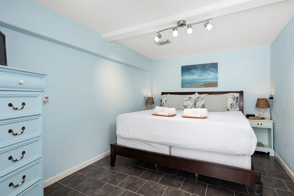 Separate bedroom room downstairs, 
private room, that has a king size bed, full bathroom, streaming TV, and a mini frig.
