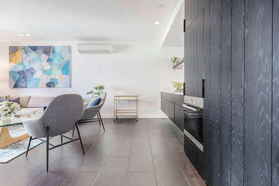 KITCHEN: Sleek lines and modern finishes create a space as functional as it is refined, fully equipped to suit every cooking occasion.
