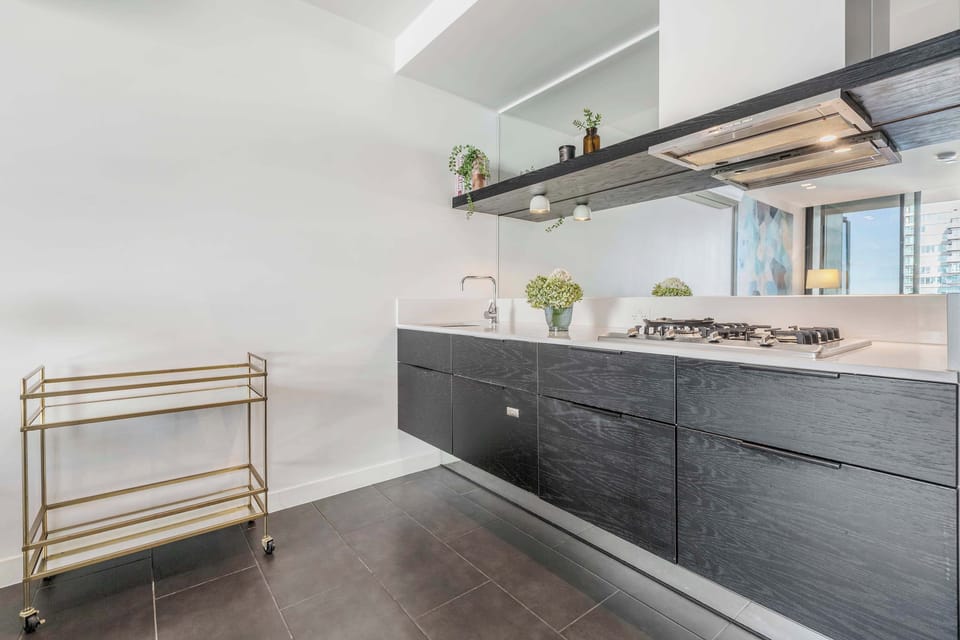 KITCHEN: Sleek lines and modern finishes create a space as functional as it is refined, fully equipped to suit every cooking occasion.