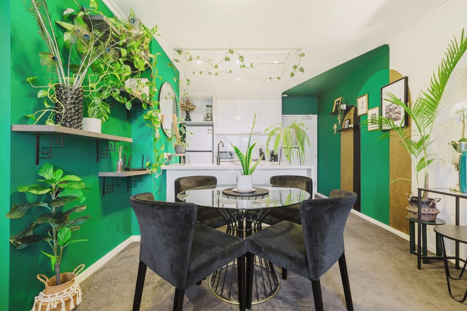 DINING AREA: Dine or sip amidst cascading greenery, a tranquil setting straight from a lush, sunlit film scene