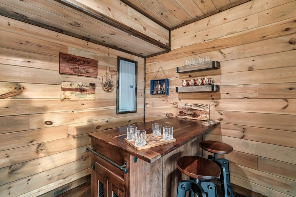 Gather around the basement bar for drinks and good company.