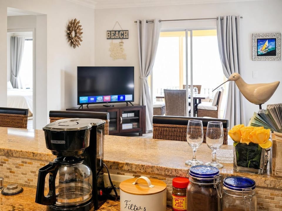 An open kitchen allows you to cook and watch your favorite shows.
