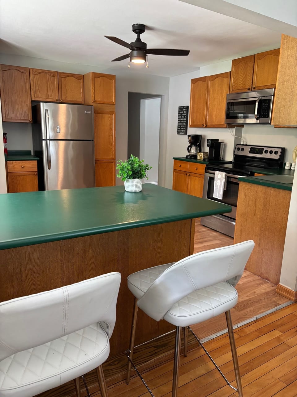 The Kitchen has an island with 3 stools. Great spot to eat or work.