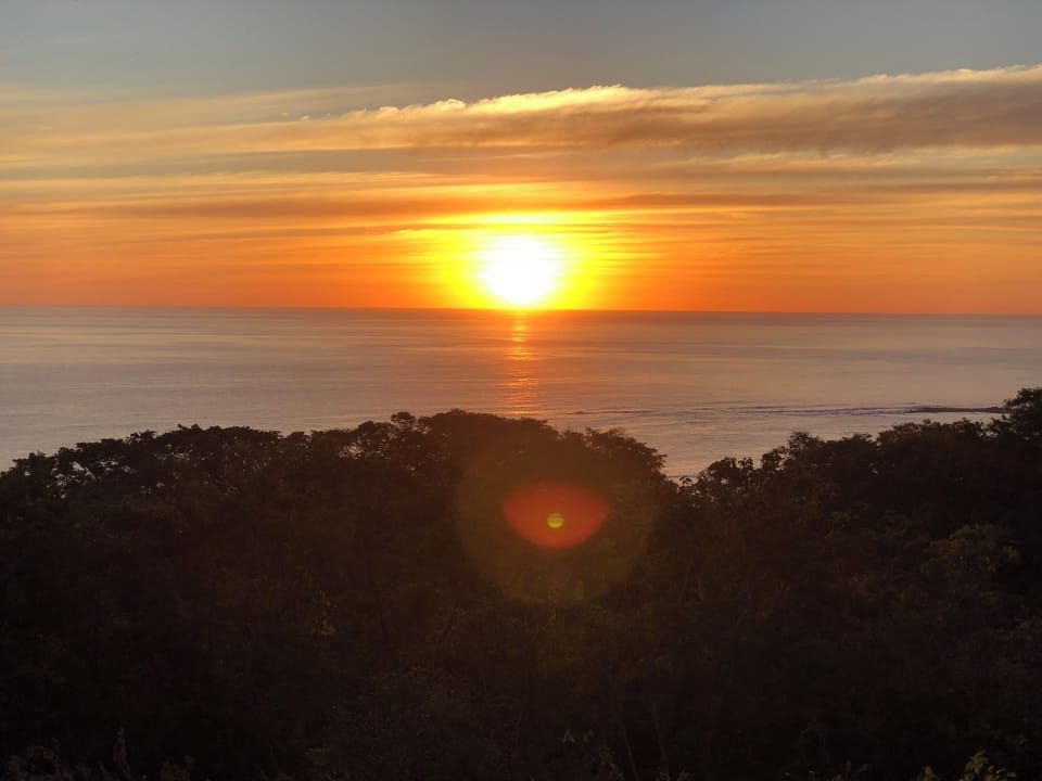 Beautiful sunsets from master suite balcony, opposite side of the ocean cove.
