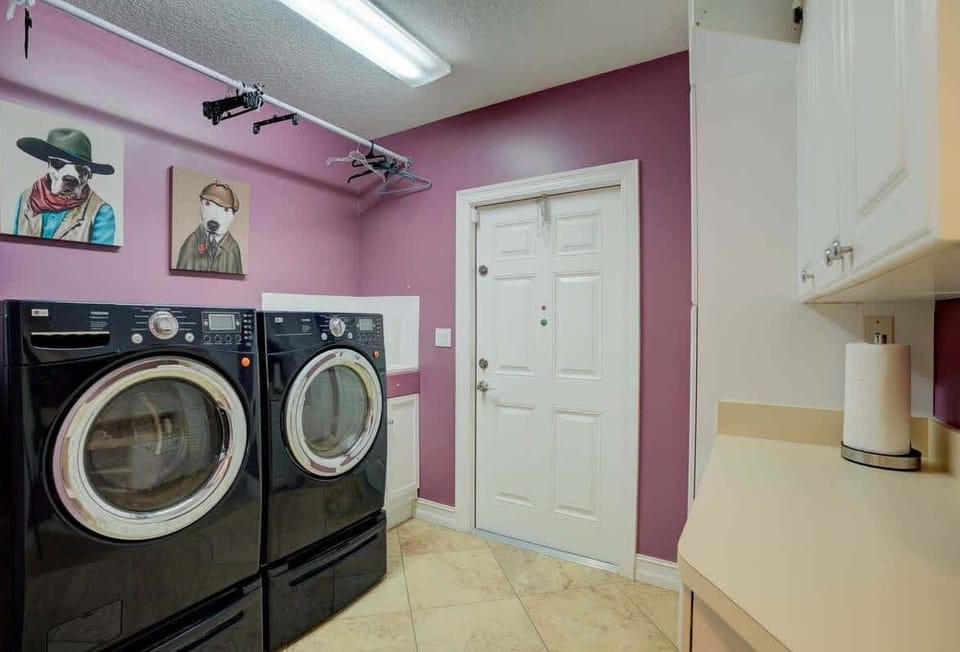 Washer and dryer with walkout to outdoor clothes line.