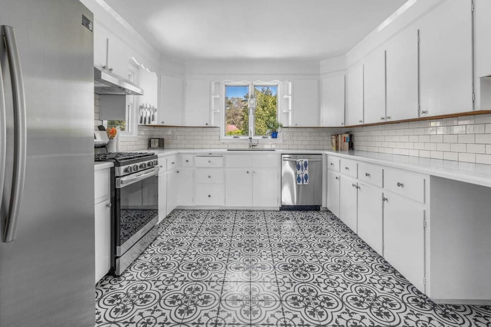 Full kitchen with brand new appliances & all the utensils / dish ware you might need to share a meal at home.