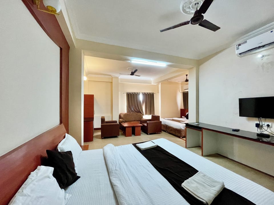 Deluxe Quadruple Room | Premium bedding, desk, laptop workspace, soundproofing