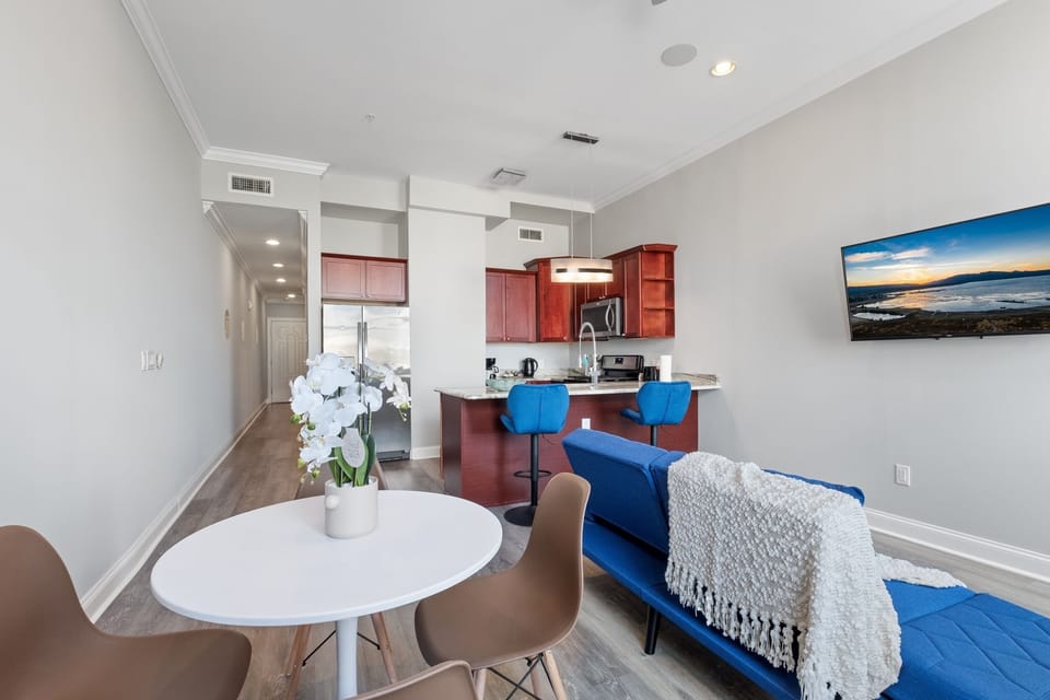  Living room with tufted blue sofa and bright atmosphere ideal for entertaining