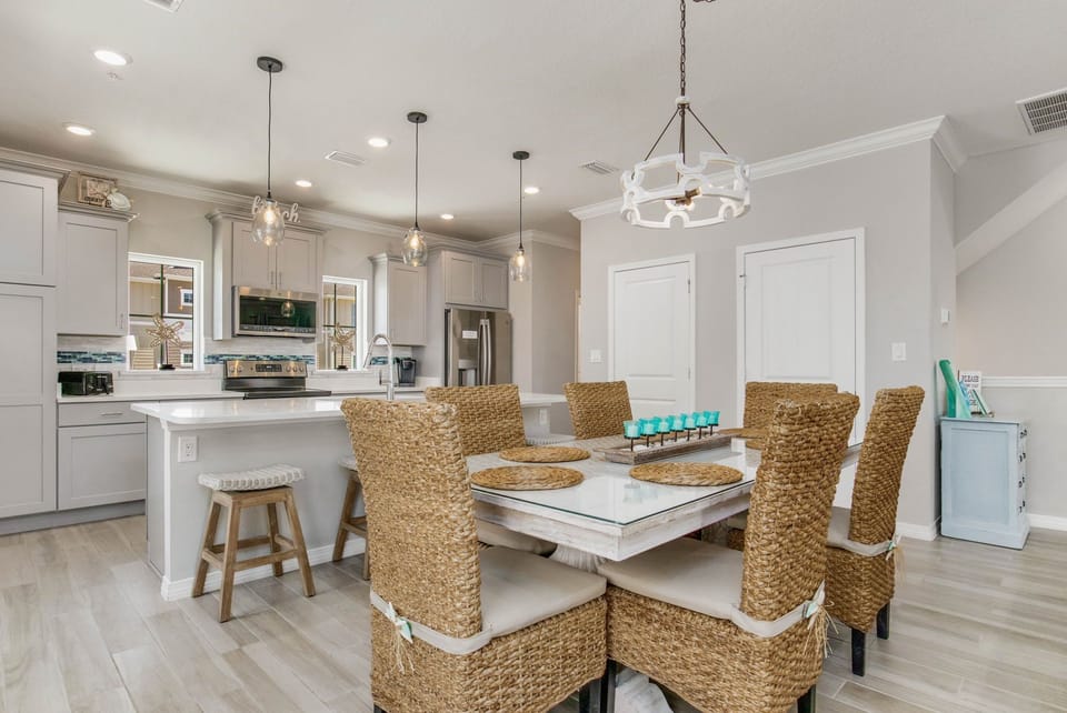 Gourmet kitchen with island seating and gas range at Battle Beach House pet-friendly rental