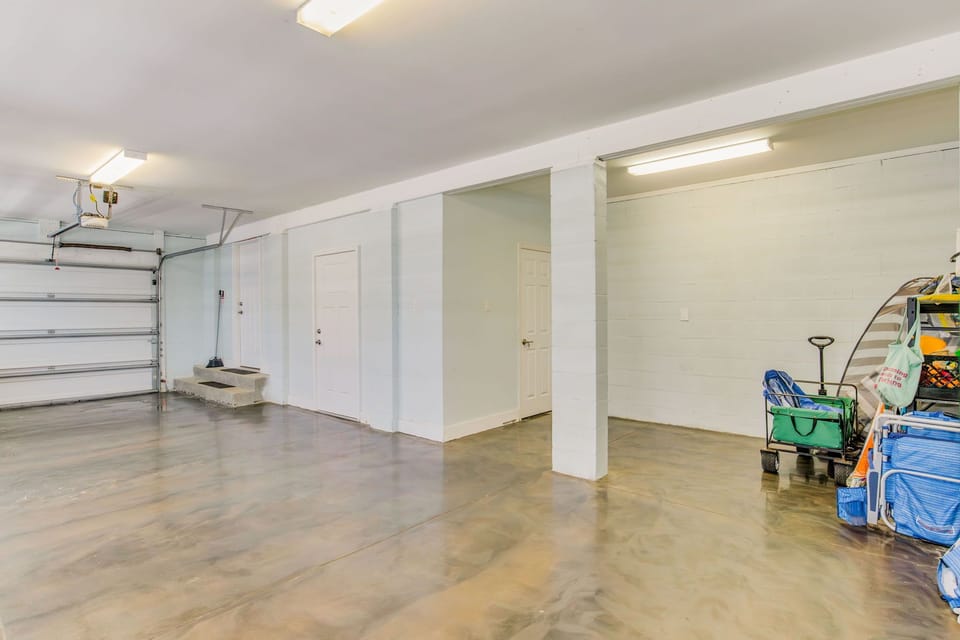 Two-car garage with beach equipment storage at Battle Beach House Lost Key pet-friendly townhome
