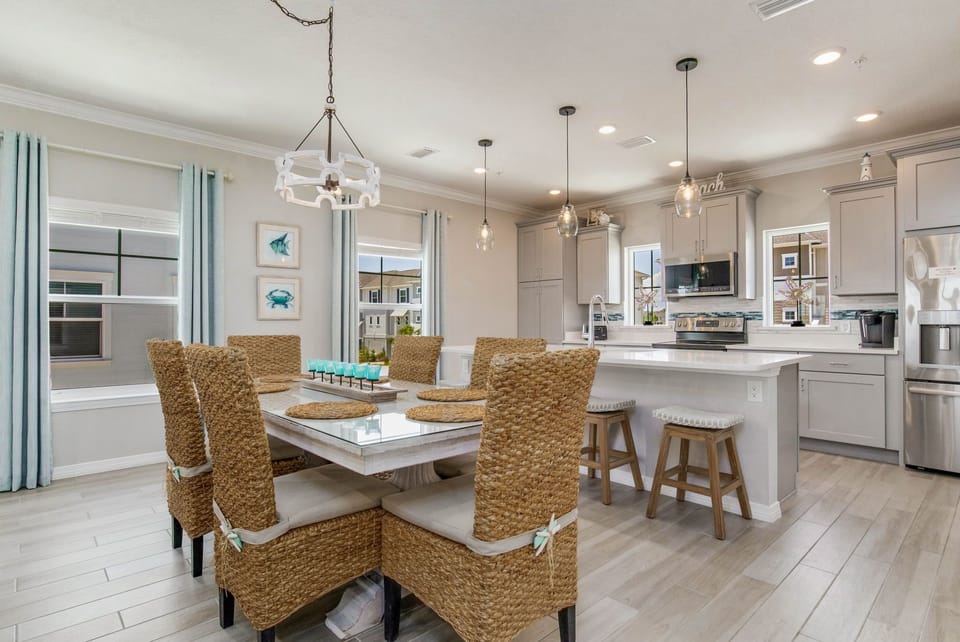 Open living space with dining and kitchen - perfect for families at Lost Key Perdido Key