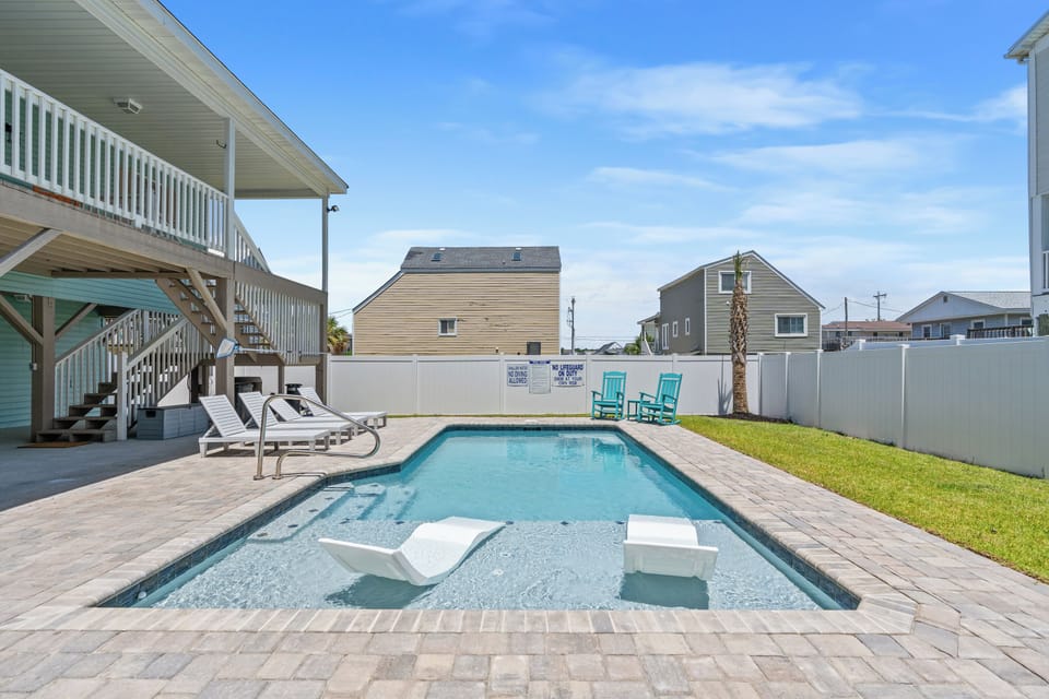 Catch some rays while the kids splash in the pool.