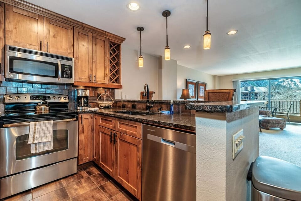 Open kitchen area with a view into the living and dining areas