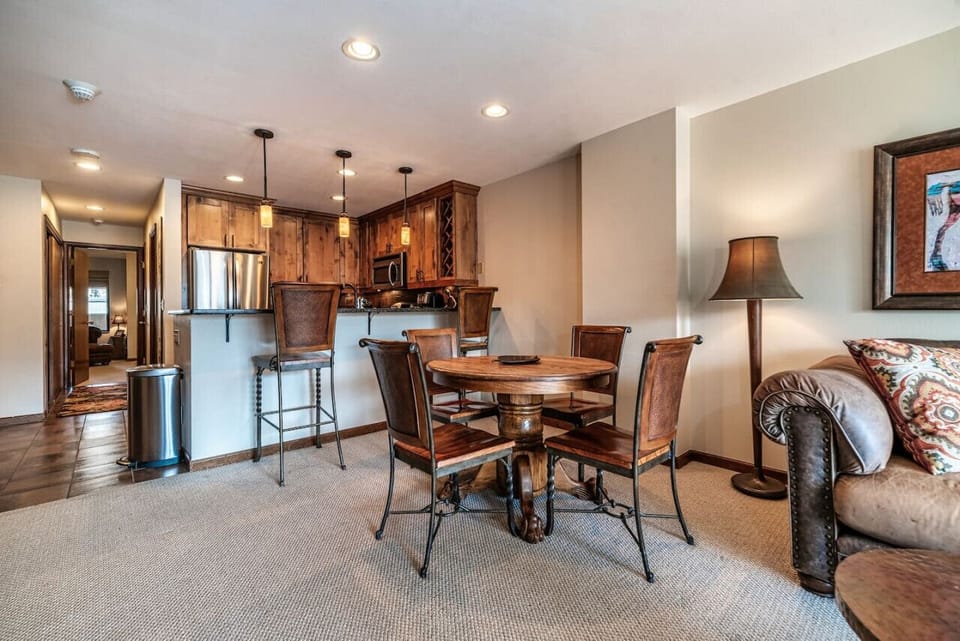Open dining and kitchen area with a cozy, rustic feel