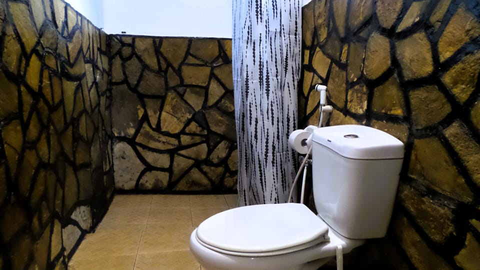 Classic Double Room, Balcony, Garden Area | Bathroom | Shower, slippers, towels, soap