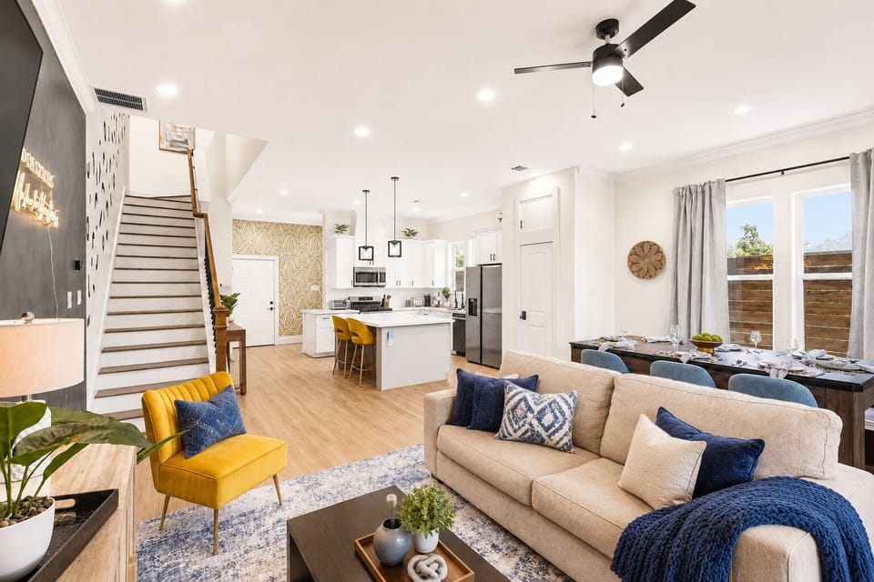 Bright open-concept living with modern kitchen, dining, and stylish decor