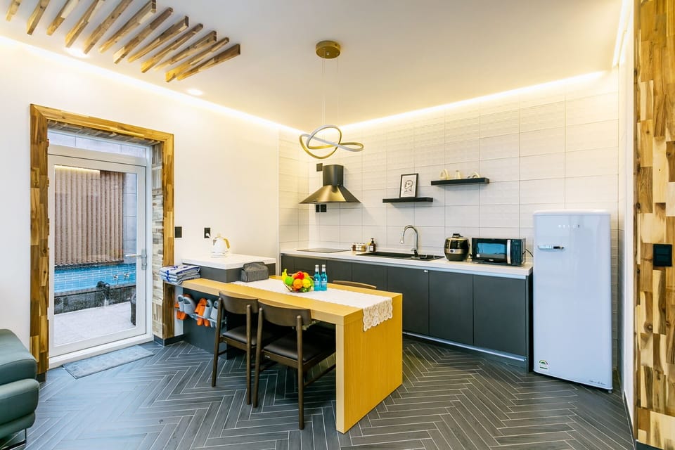 30py Ocean Pool Spa | Private kitchen | Fridge, microwave, cookware/dishes/utensils, dining tables