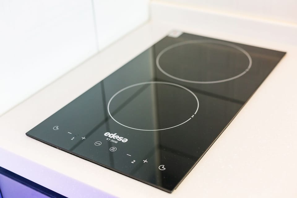 Fridge, microwave, cookware/dishes/utensils, dining tables