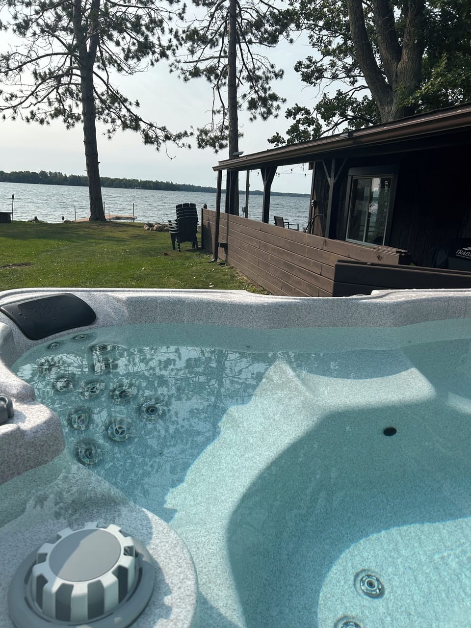 Soak your worries away in the lake side hot tub