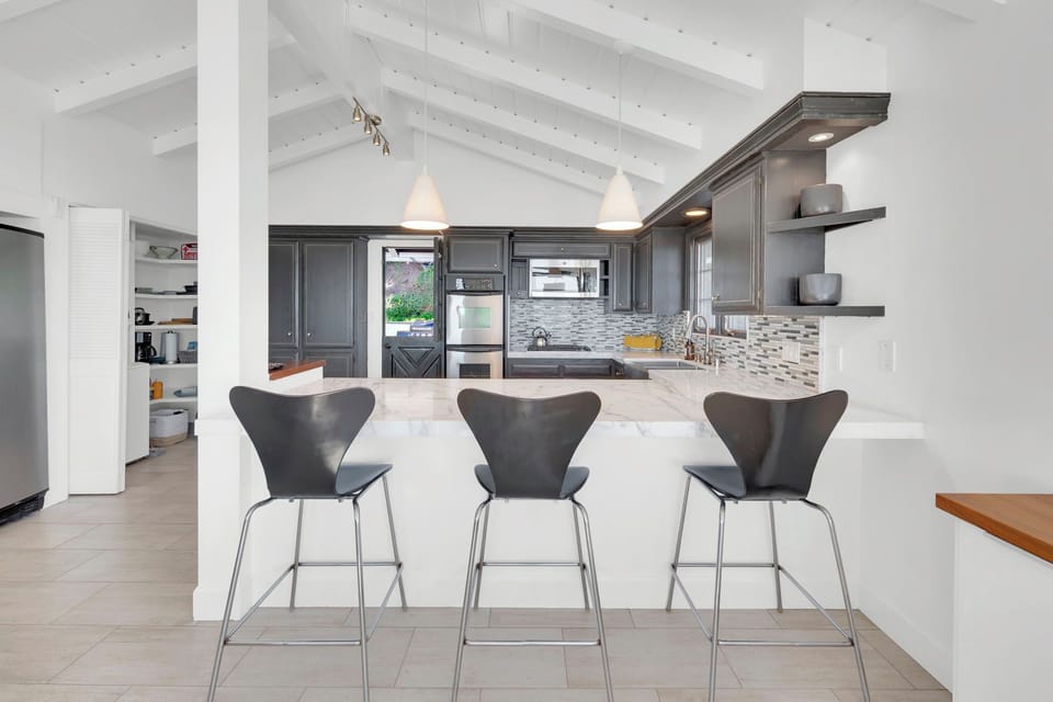 Kitchen with counter barstools
