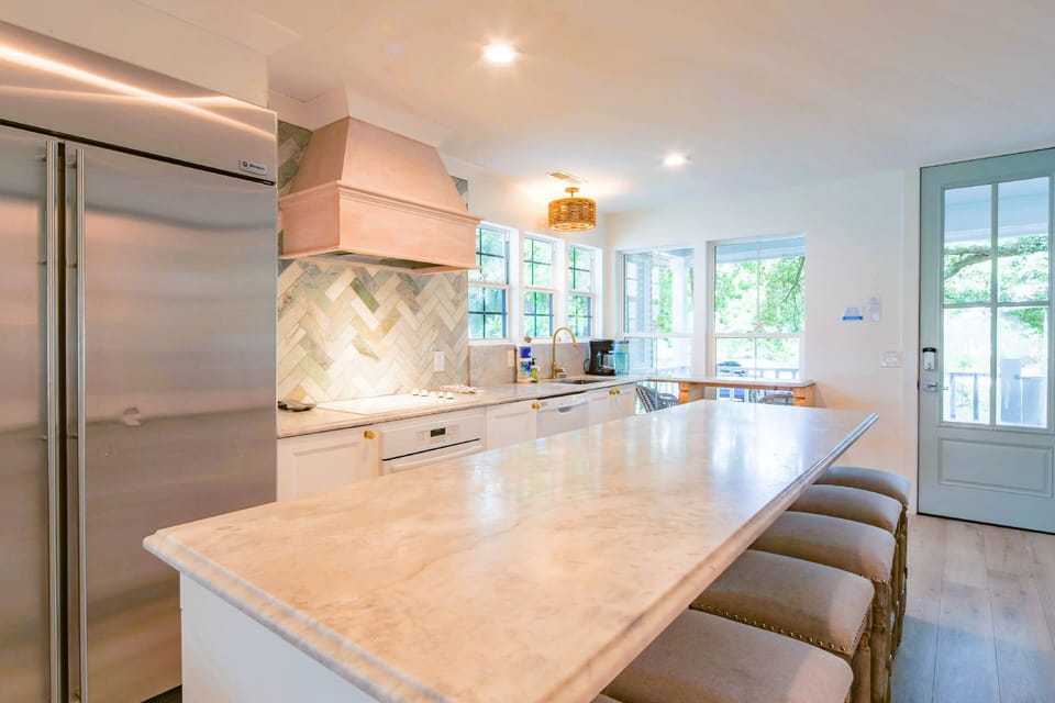 The Beach Cove features a gorgeous, fully renovated kitchen with a central island.