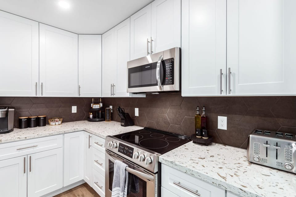 Stainless Steel Appliances and Crisp White Cabinets