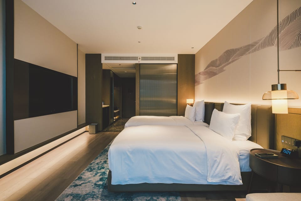 Premium bedding, down comforters, free minibar items, in-room safe