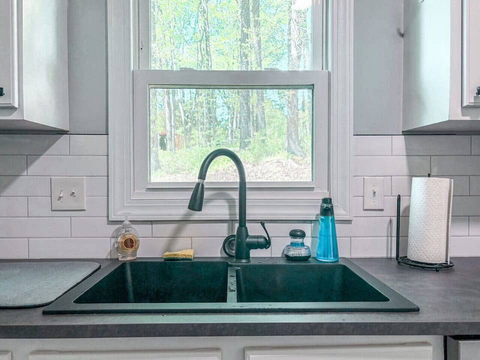 Kitchen equipped with: microwave, toaster, stove, oven, dishwasher, cooking utensils, pots, pans, etc.