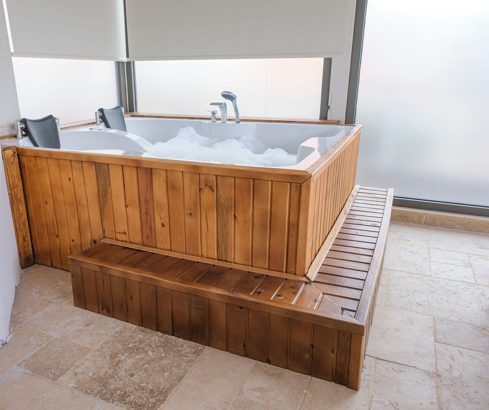 Luxury Suite, Terrace, Pool View | Jetted tub