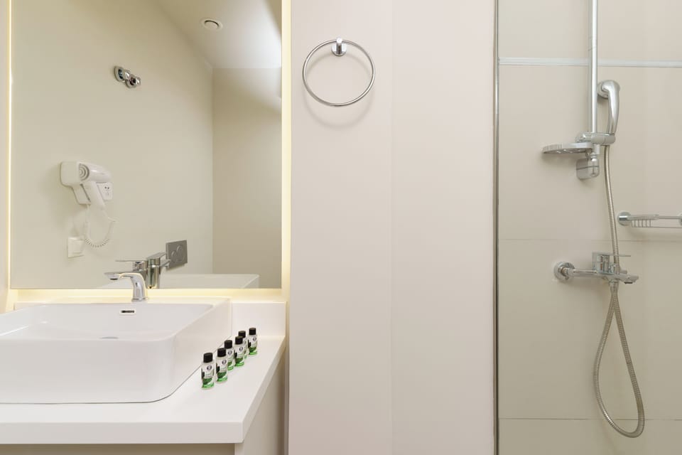 Shower, hair dryer, slippers, towels