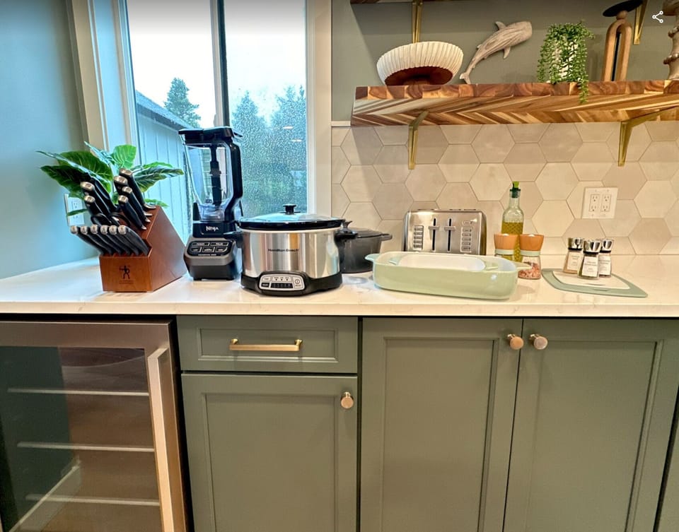 Open-concept kitchen with full amenities and appliances.