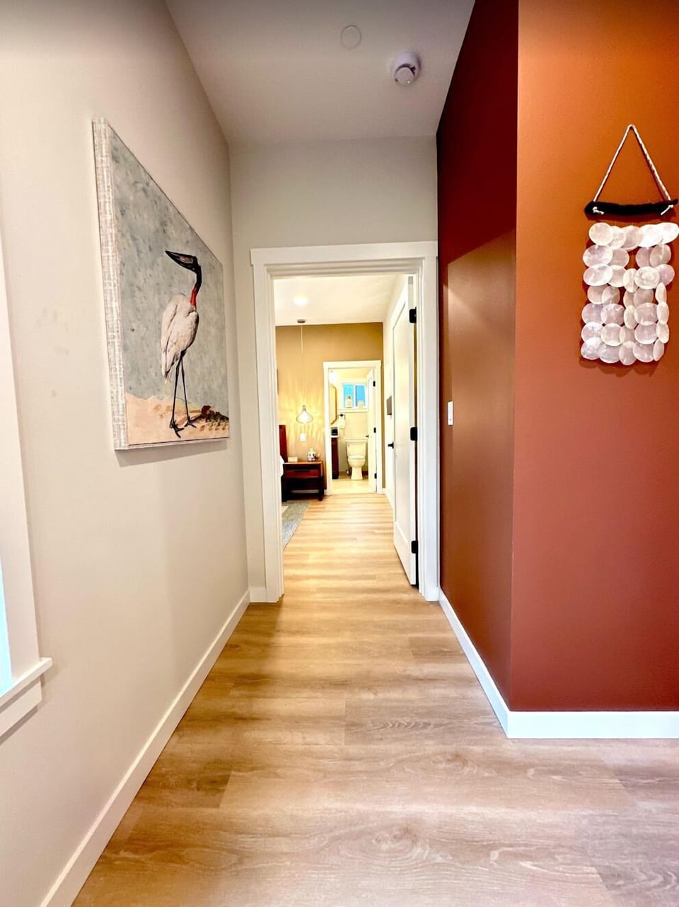 Hallway to the primary bedroom/bath on the top floor.