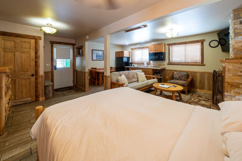 Log wood furniture cabin with an open floor plan.