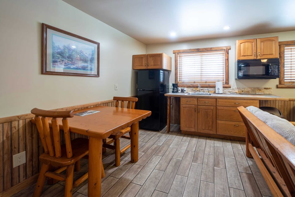 Kitchen area with a wood dining table.