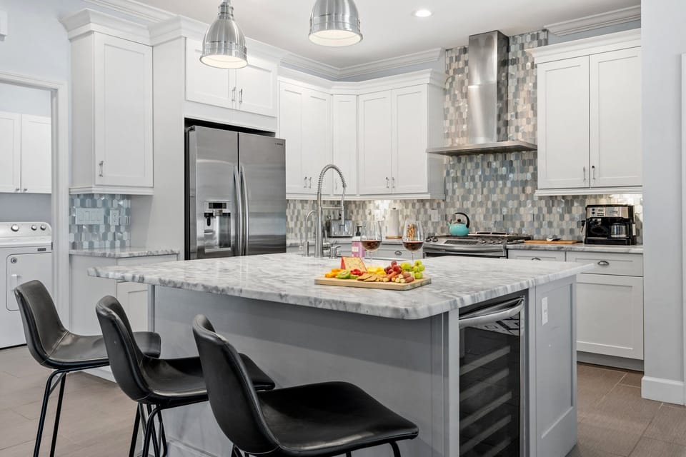 Features top-of-the-line stainless steel appliances and a large island perfect 