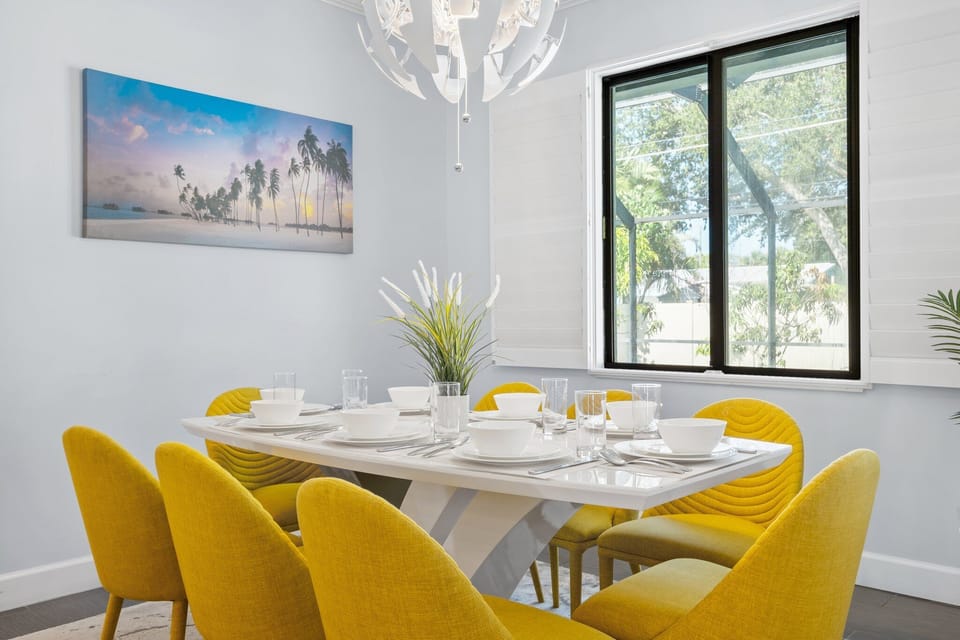  Cheerful yellow chairs and window view overlooking the pool