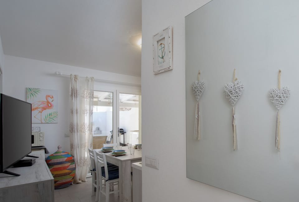 Apartment, Garden View | Living area | 35-inch TV with digital channels