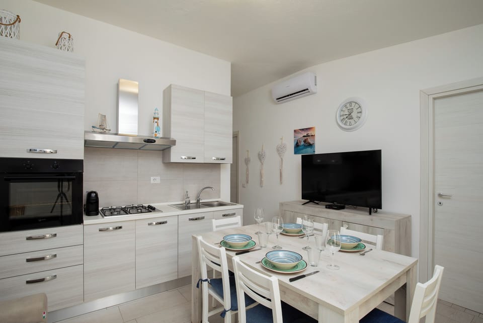 Apartment, Garden View | Private kitchen | Espresso maker, highchair