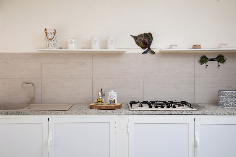 Apartment, Garden View | Private kitchen | Espresso maker, highchair